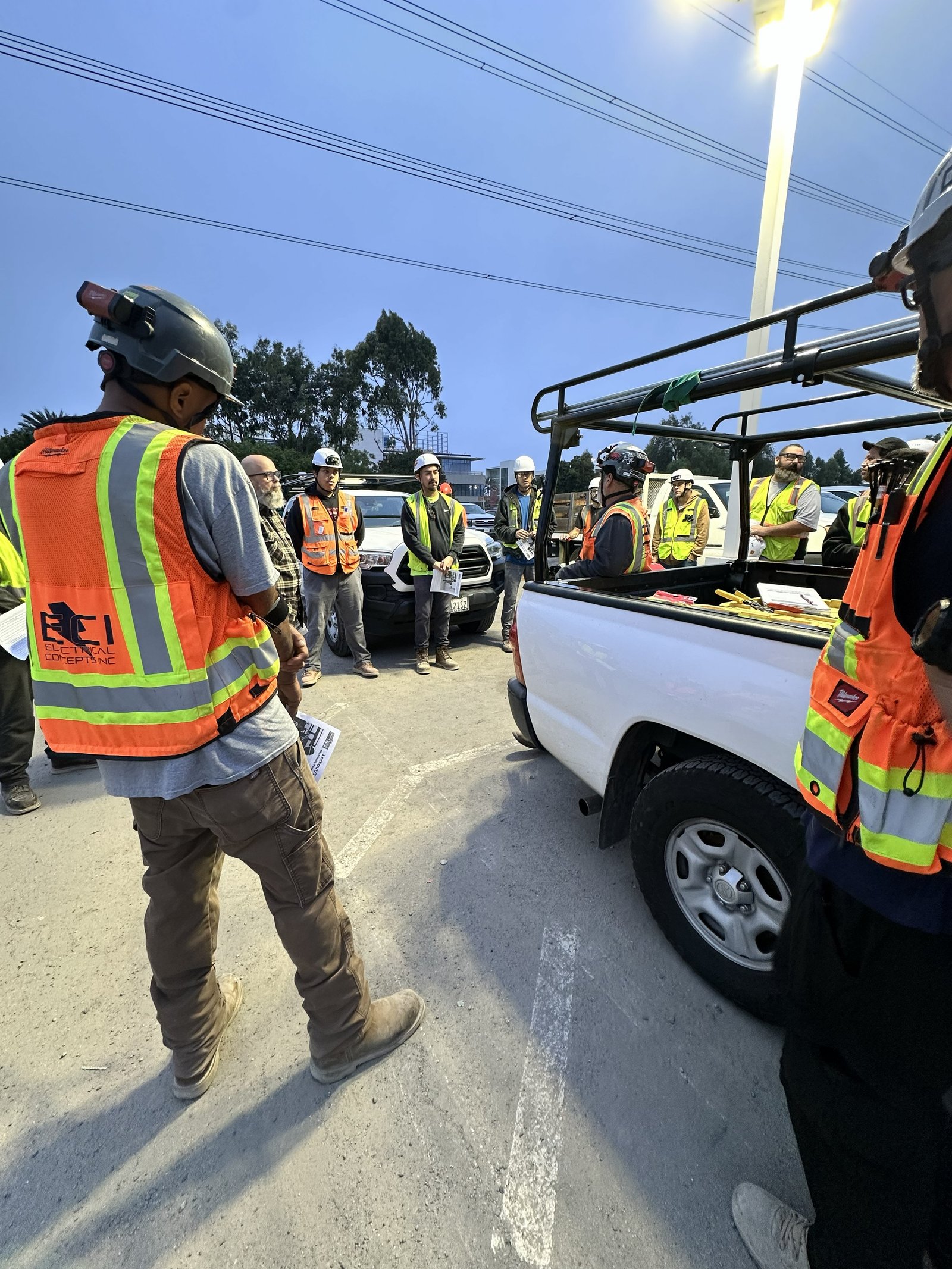 Electrical Concepts Inc. team briefing on a jobsite